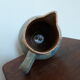 Pitcher ceramic  tones blue, green and caramel