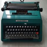 Studio 45 with his suitcase olivetti typewriter