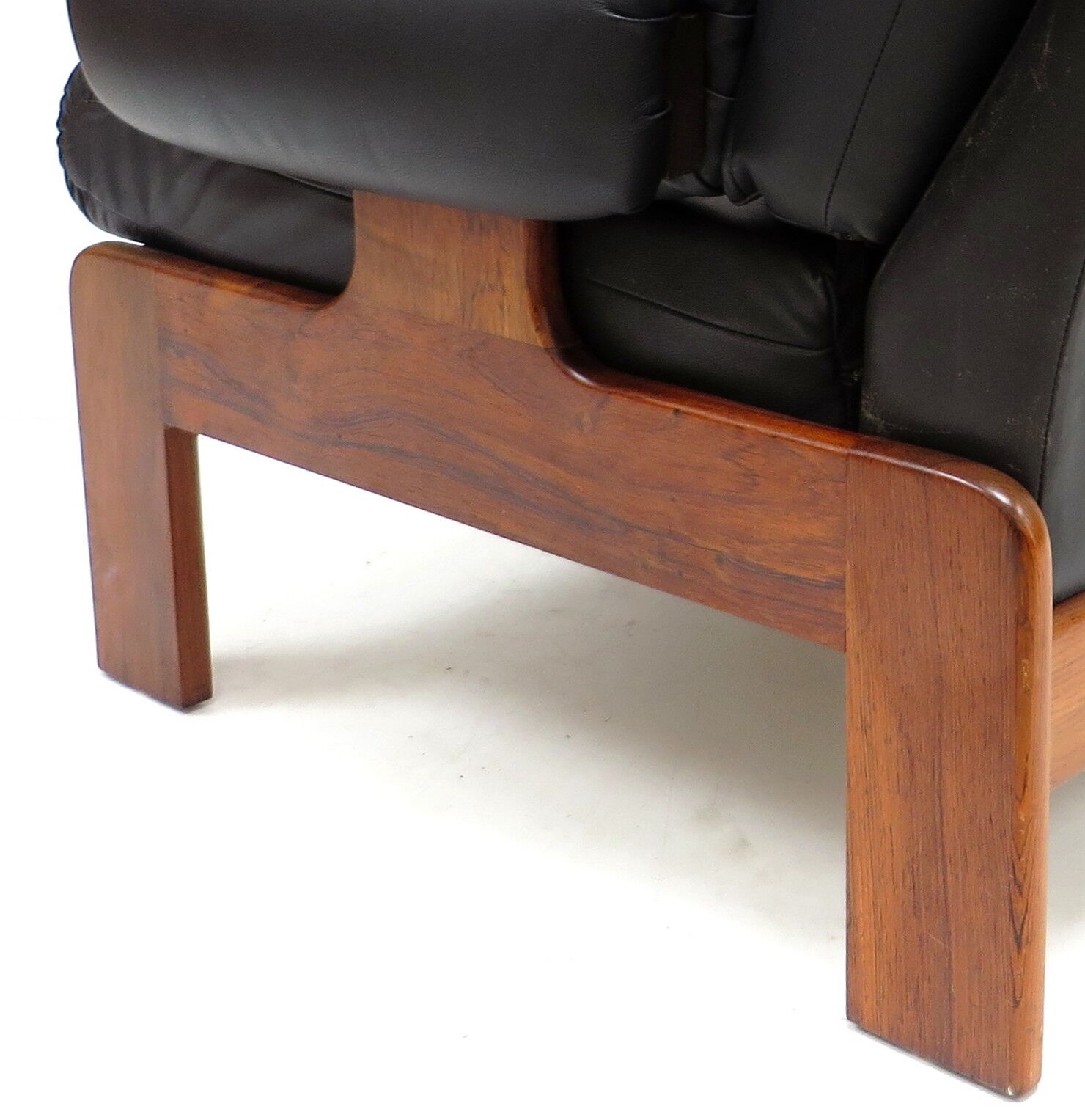 Vintage black leather armchair with solid rosewood frame made in the 1960s
