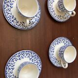 Set of 4 cups with white and blue saucers