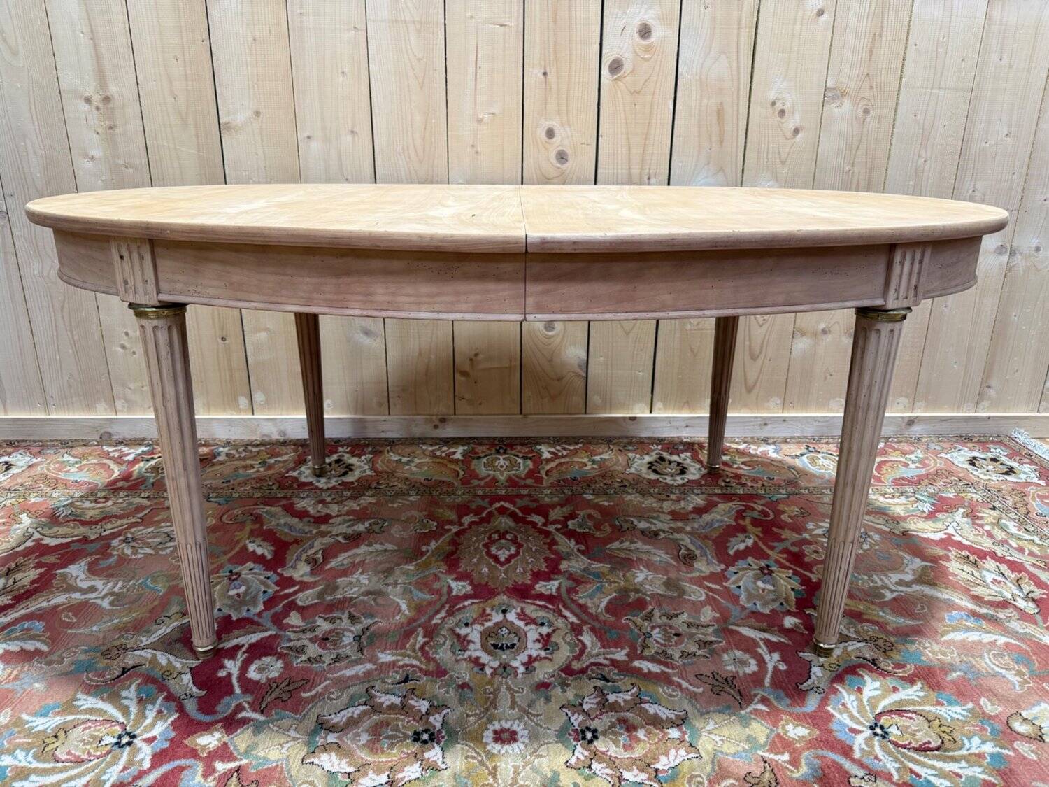 Oval Louis XVI dining table in cherry wood.