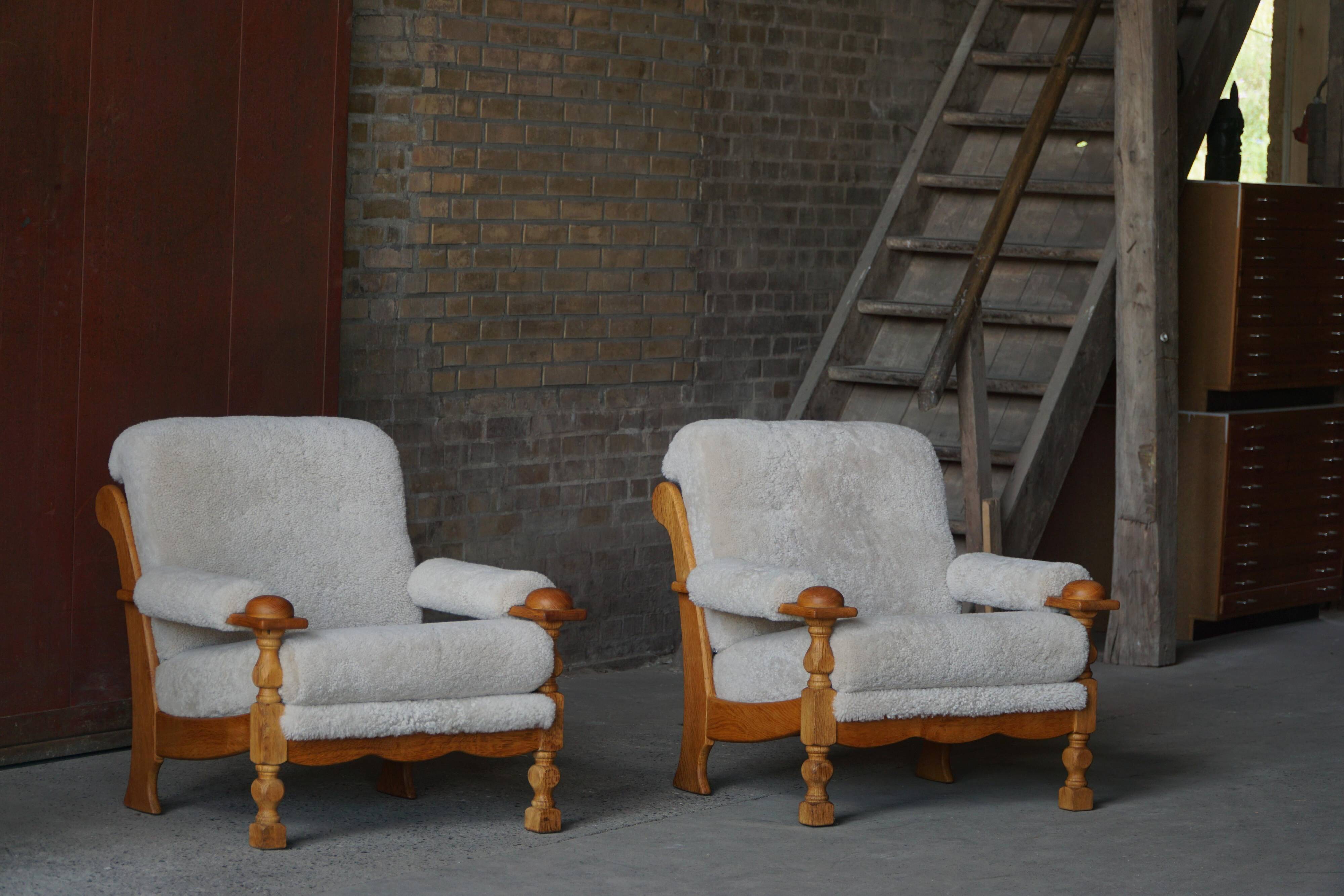 Henning Kjærnulf, lounge chairs in oak and lambswool, mid-century Danish, 1960s.