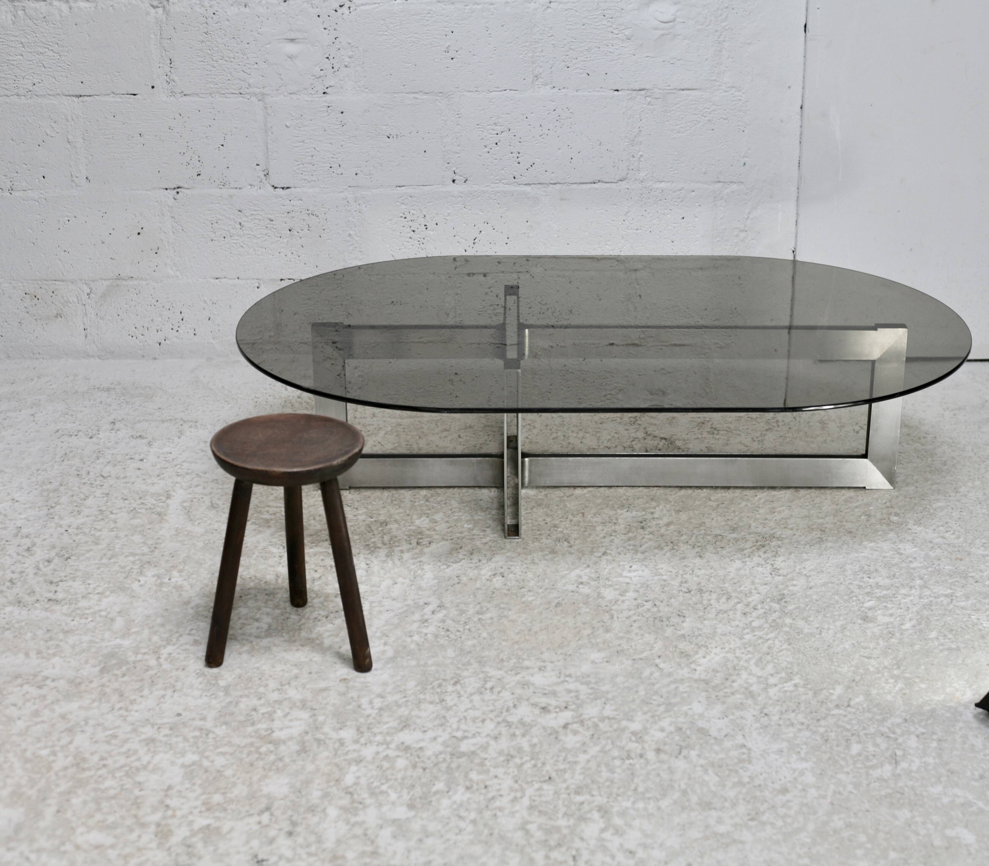 Coffee table with steel base and smoked glass slab. Circa 197