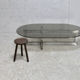 Coffee table with steel base and smoked glass slab. Circa 197