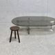 Coffee table with steel base and smoked glass slab. Circa 197