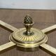 Neoclassical Round Coffee Table in Brass with Fluted Supports and Floral Motifs