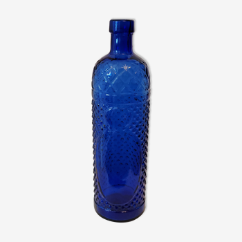 Vintage decanter bottle made of blue molded pressed glass