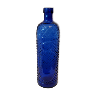 Vintage decanter bottle made of blue molded pressed glass