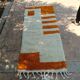 Handmade orange and white wool rug, traditionally crafted, size 140 x 260 cm