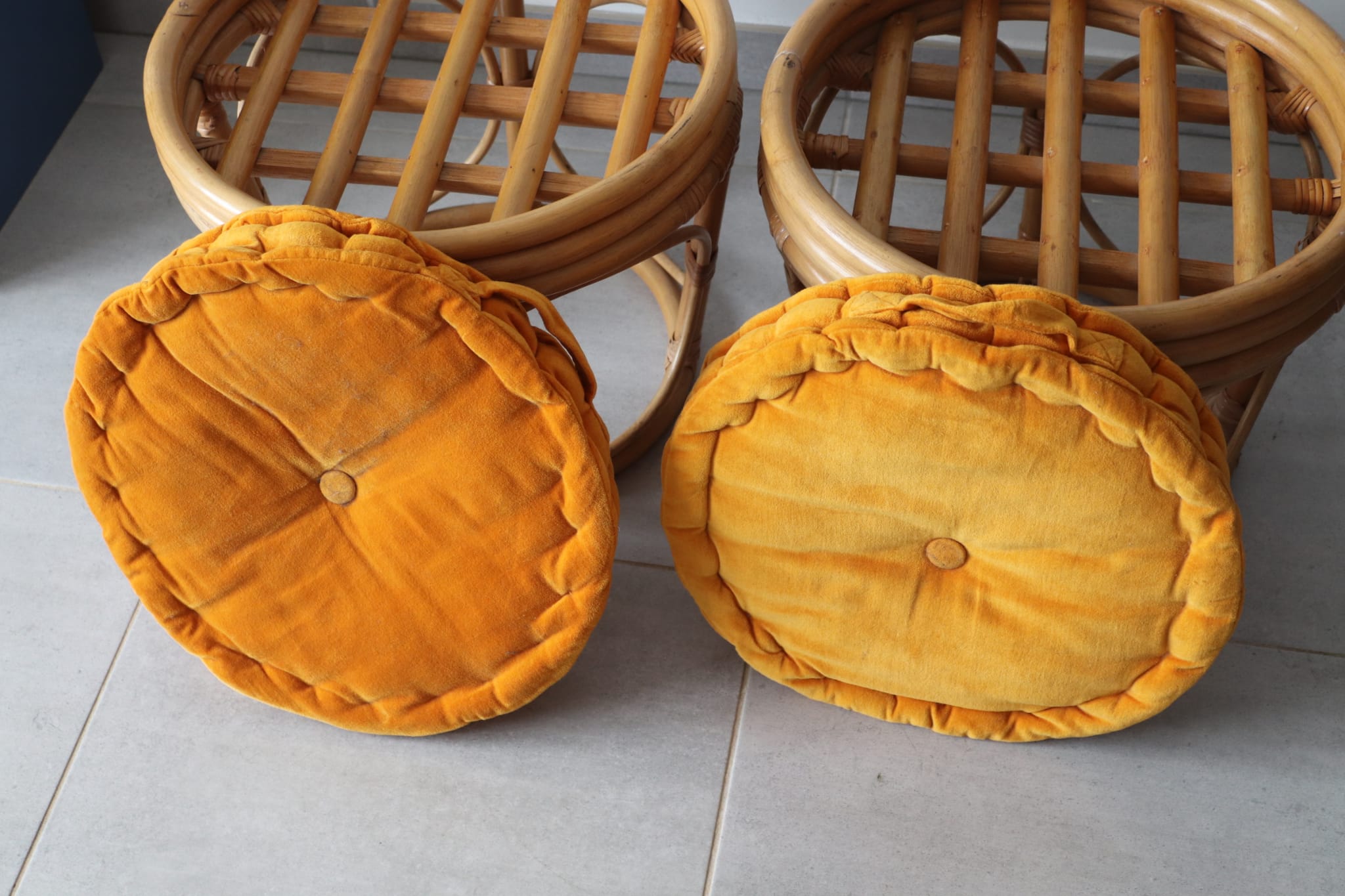 Two vintage rattan ottomans