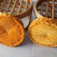 Two vintage rattan ottomans