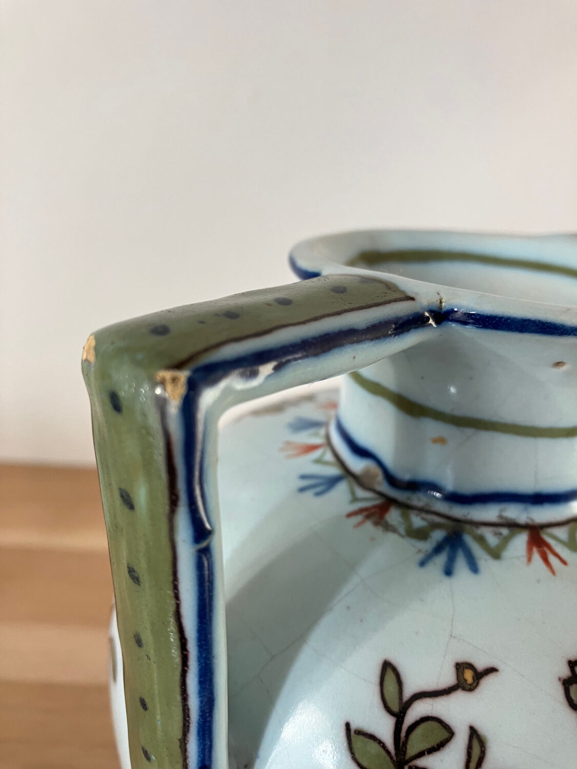 Old vase with floral motif inspired by desvres earthenware