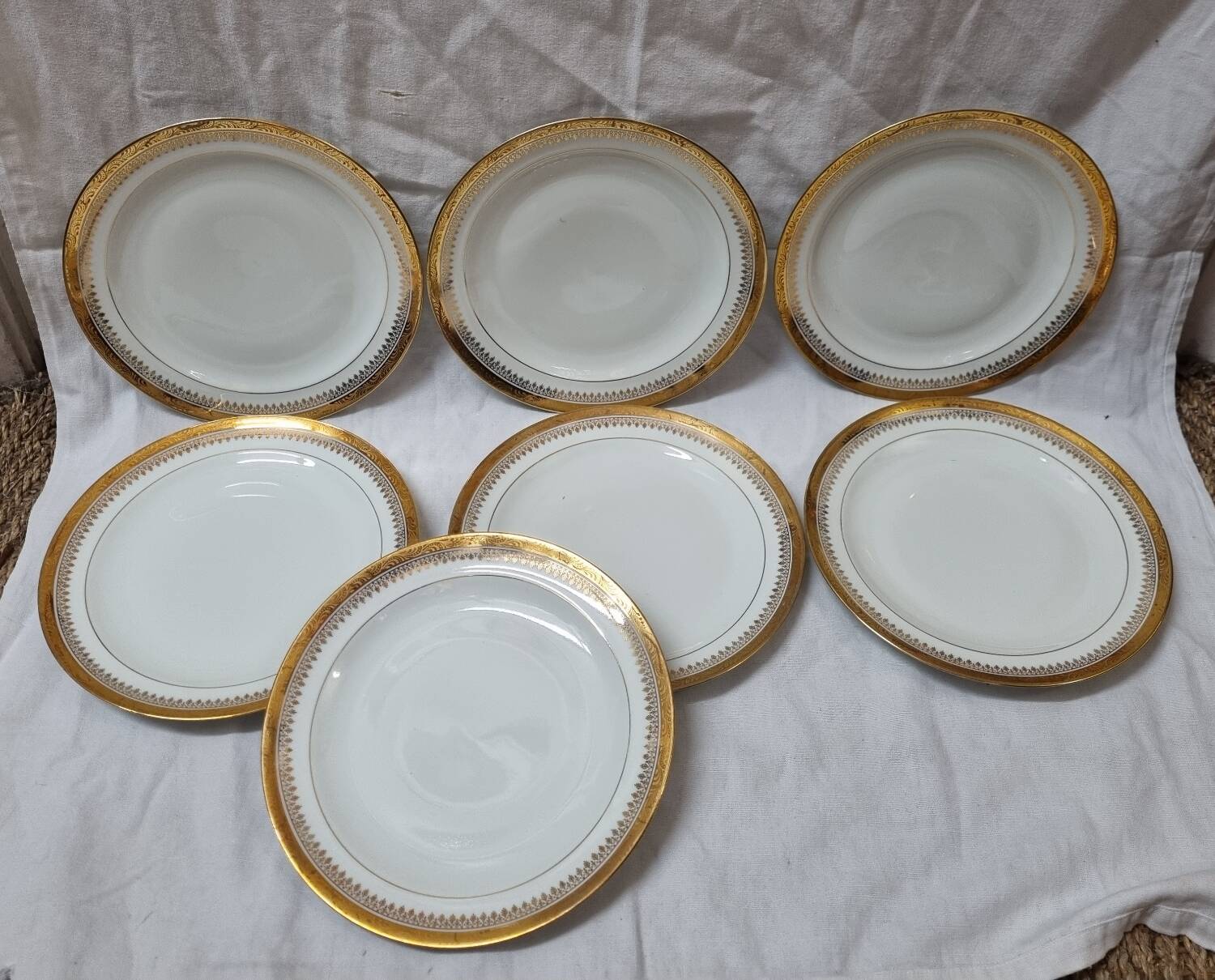 7 assiettes Limoges doré à l'or fin