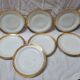7 assiettes Limoges doré à l'or fin