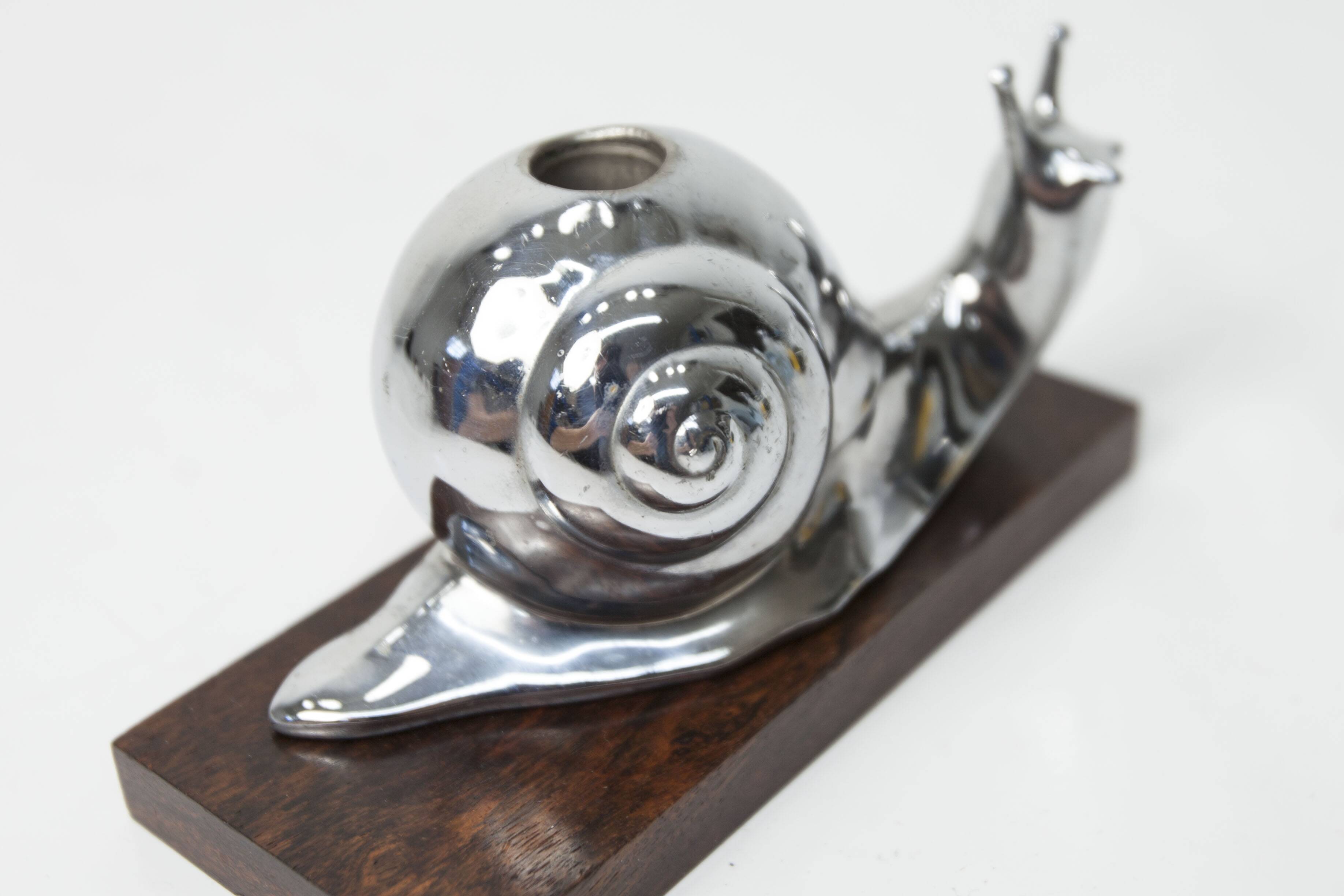 Silver snail candlestick on a teak base 1960