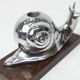 Silver snail candlestick on a teak base 1960