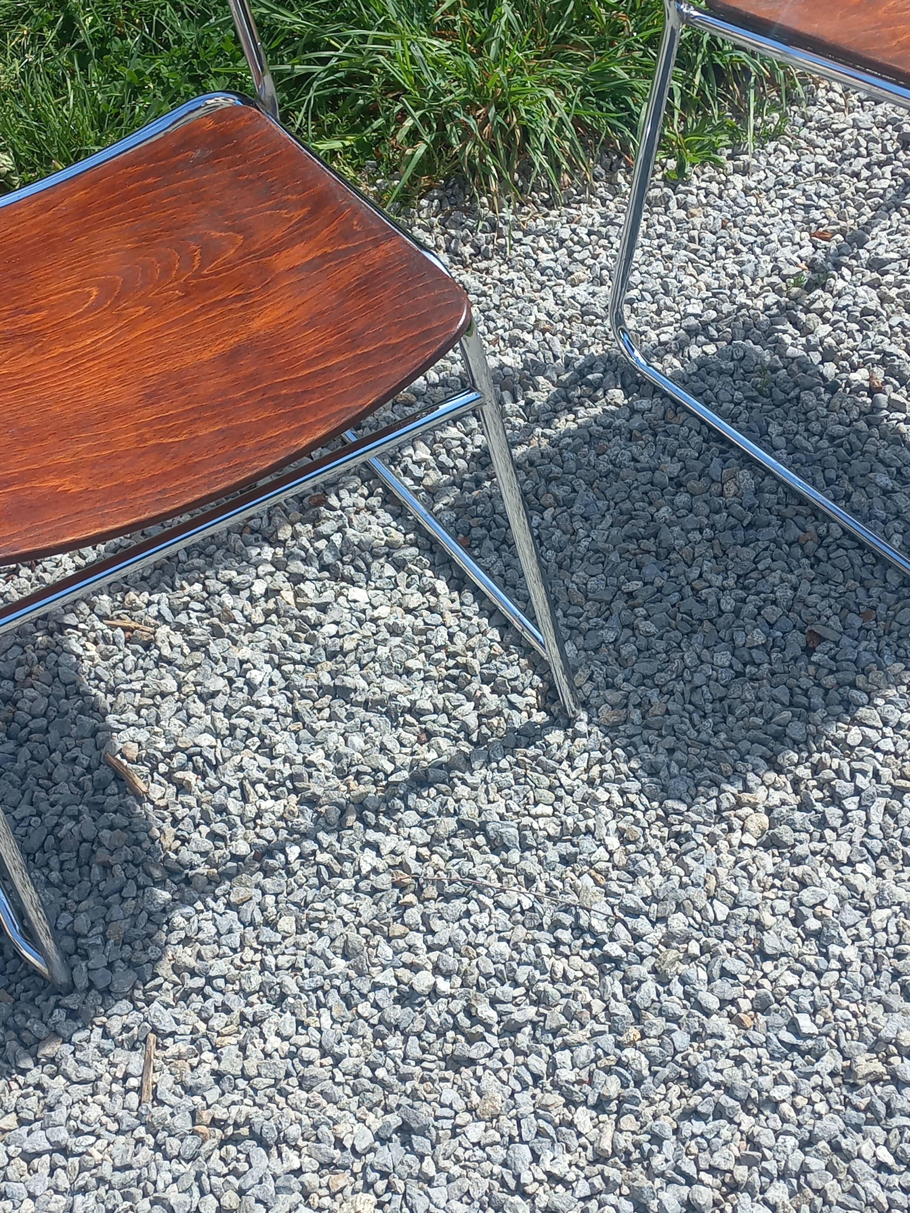 Pair of 1970s designer chairs in chrome metal and wood.