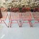 4 red design chairs