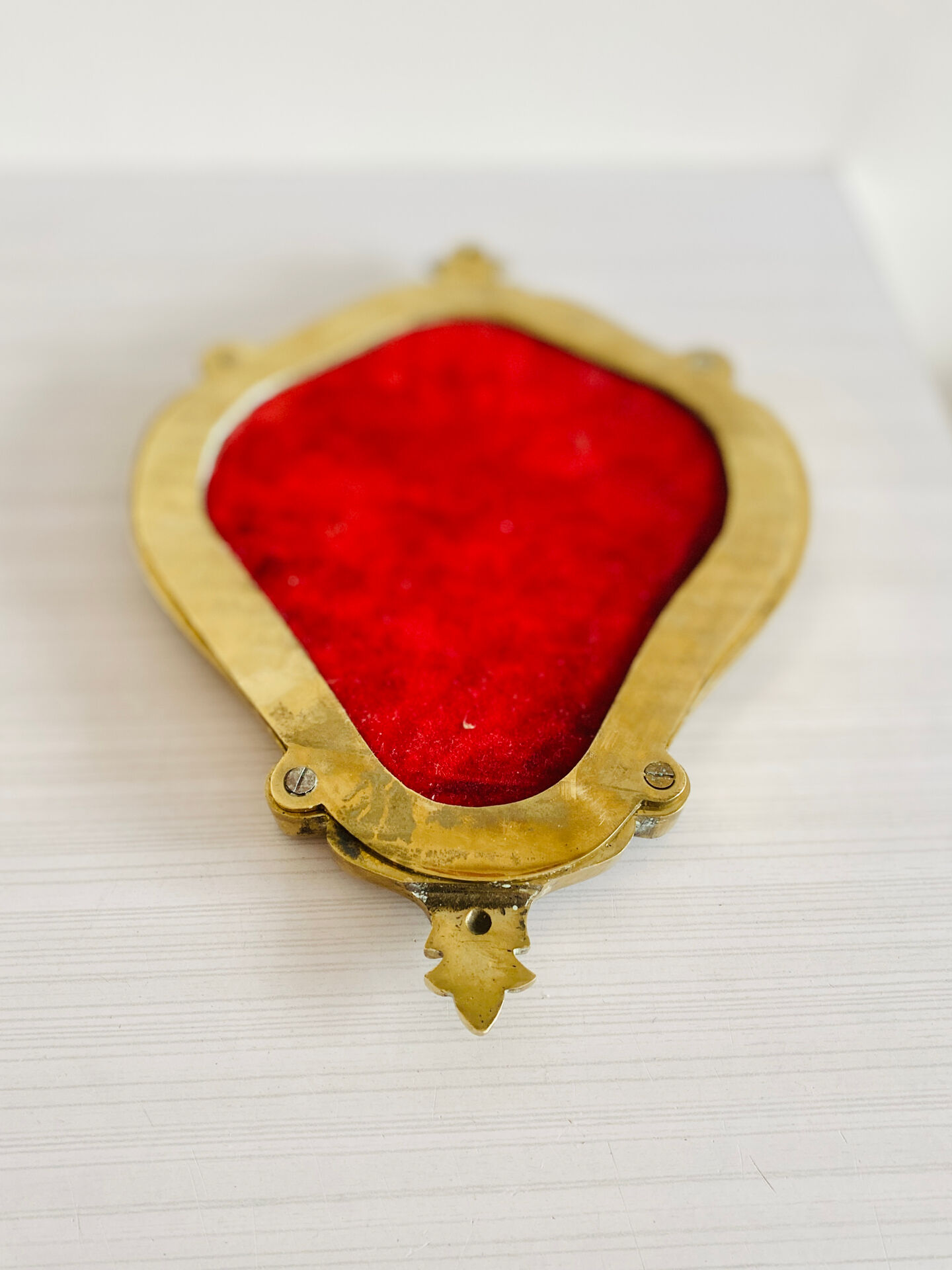 Small antique mirror in baroque style – gold frame in bronze or brass.