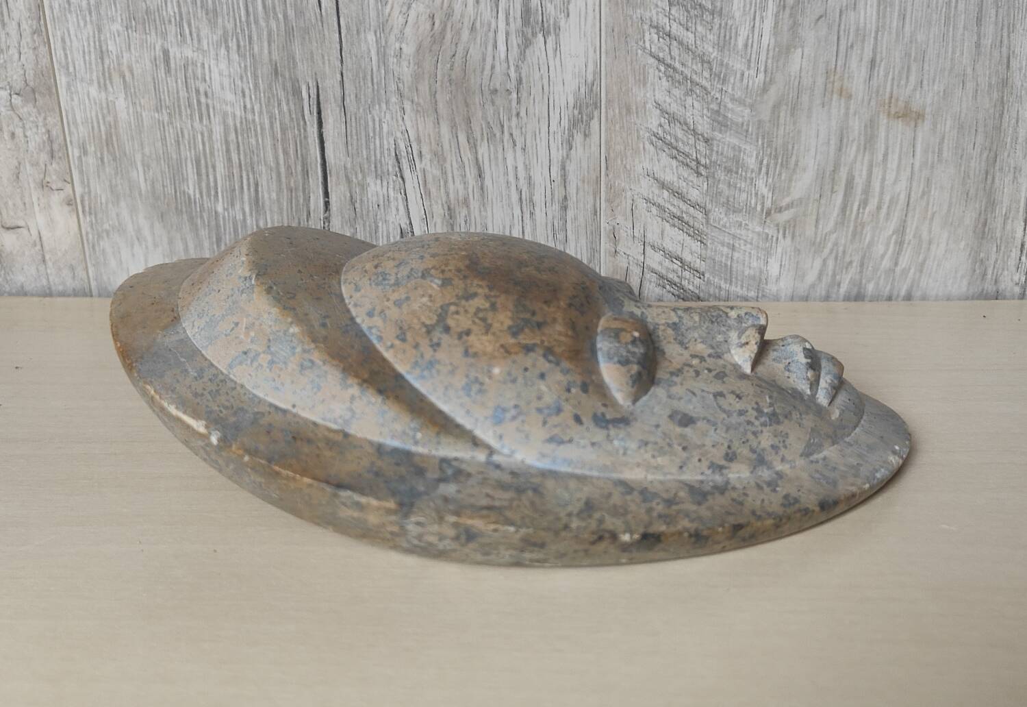 African stone face sculpture