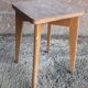 Vintage wooden stool with 4 legs from the 50s