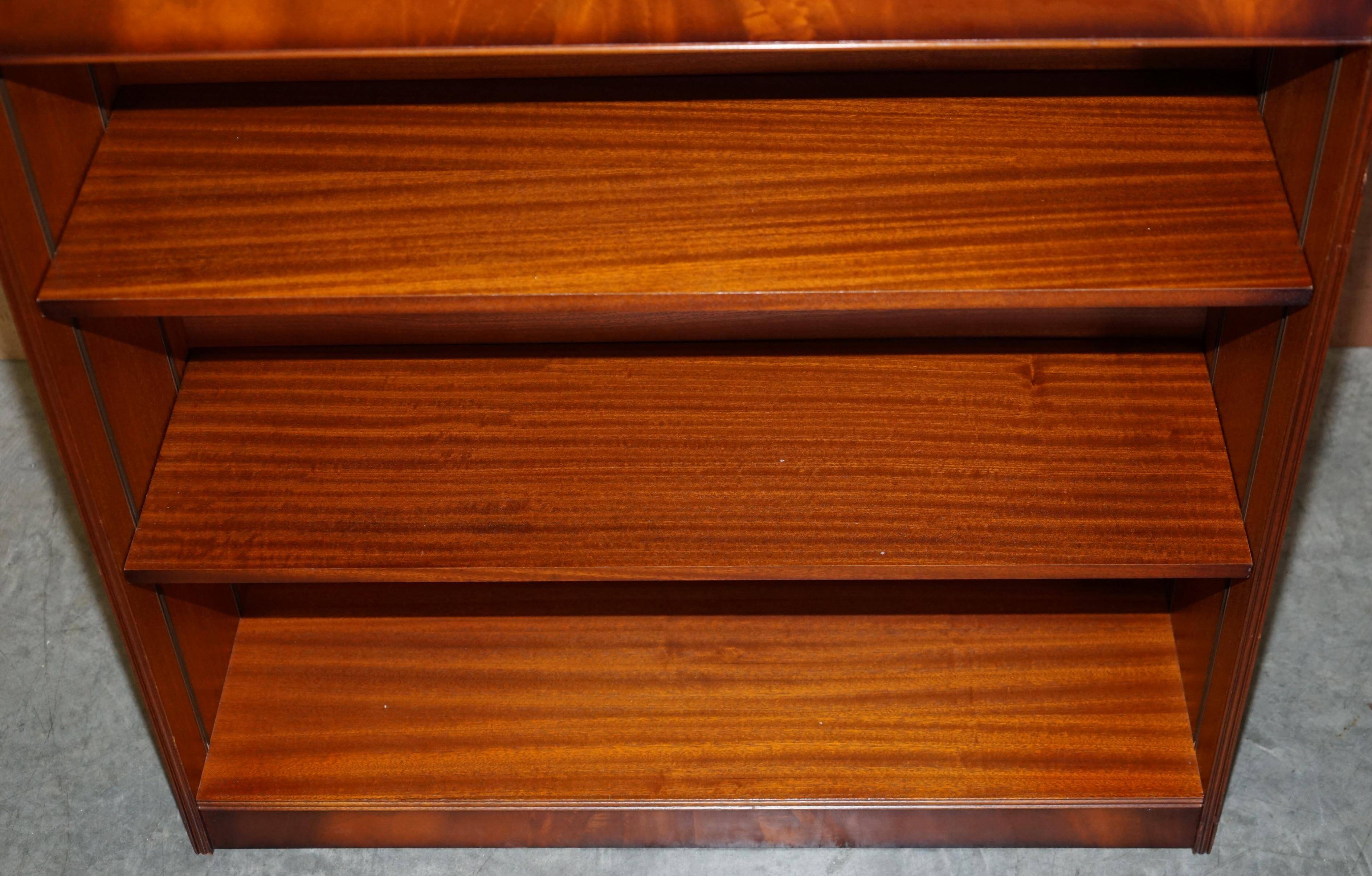 Pair of open dwarf bookshelves in mahogany by Shaws of London.