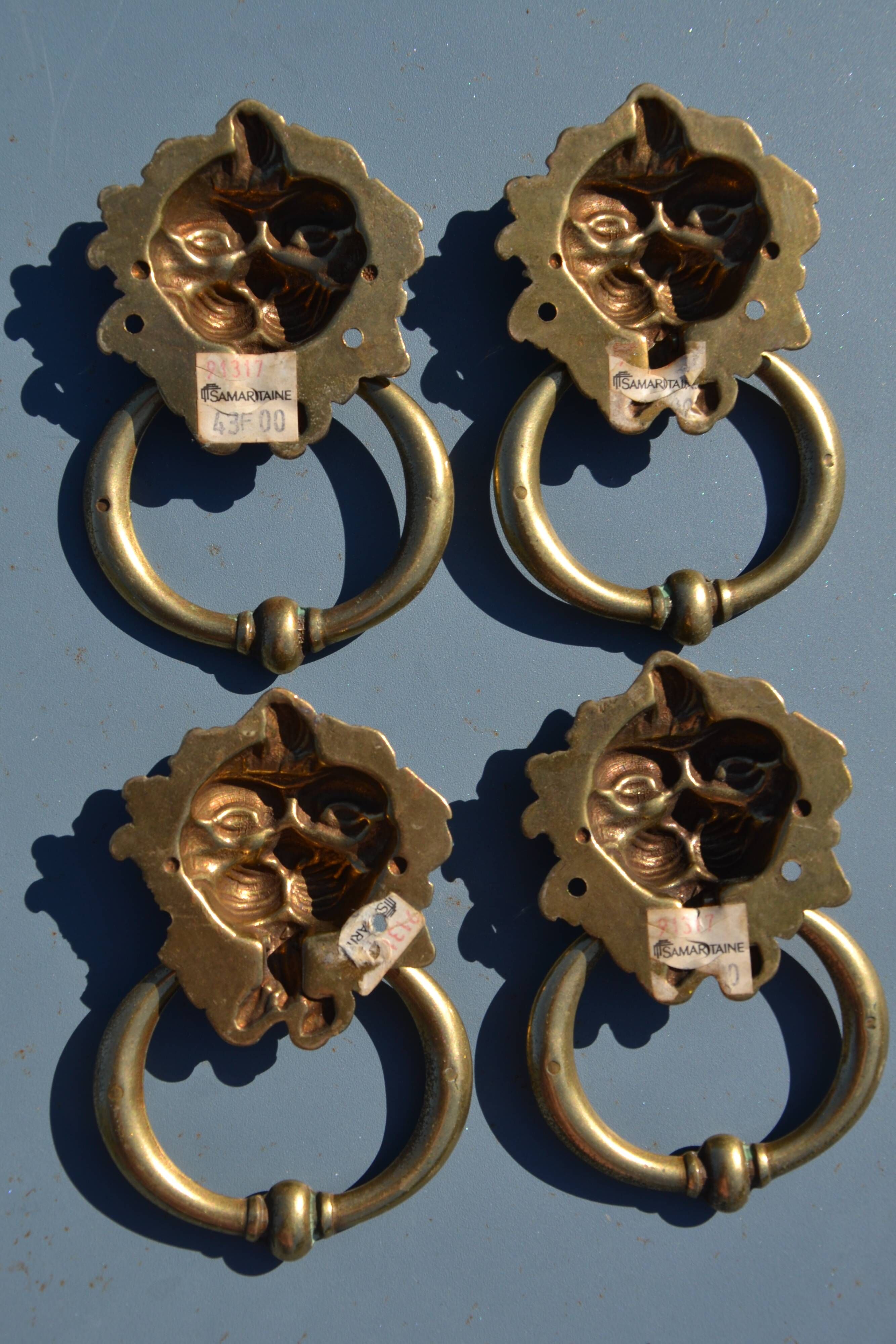 4 antique lion head furniture handles from La Samaritaine.