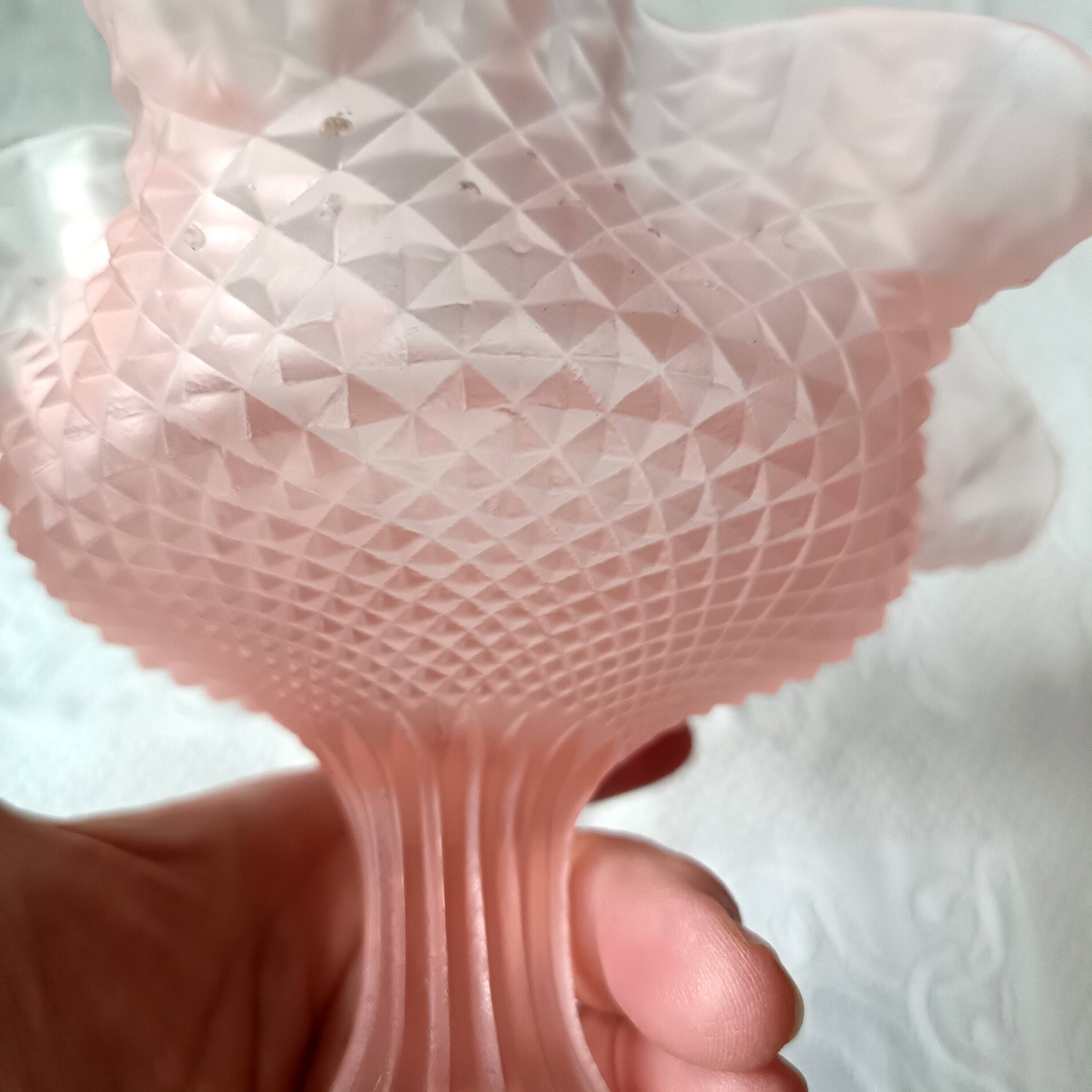 Small pink glass bowl on shabby foot, empty pocket