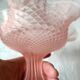Small pink glass bowl on shabby foot, empty pocket