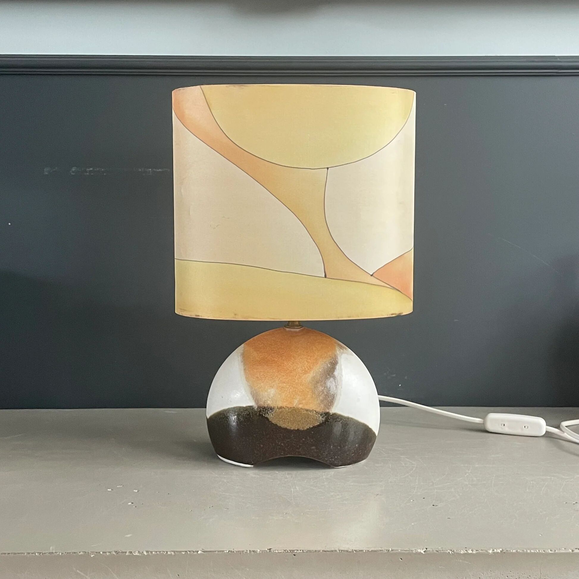 Ceramic floor lamp with a silk shade, signed.