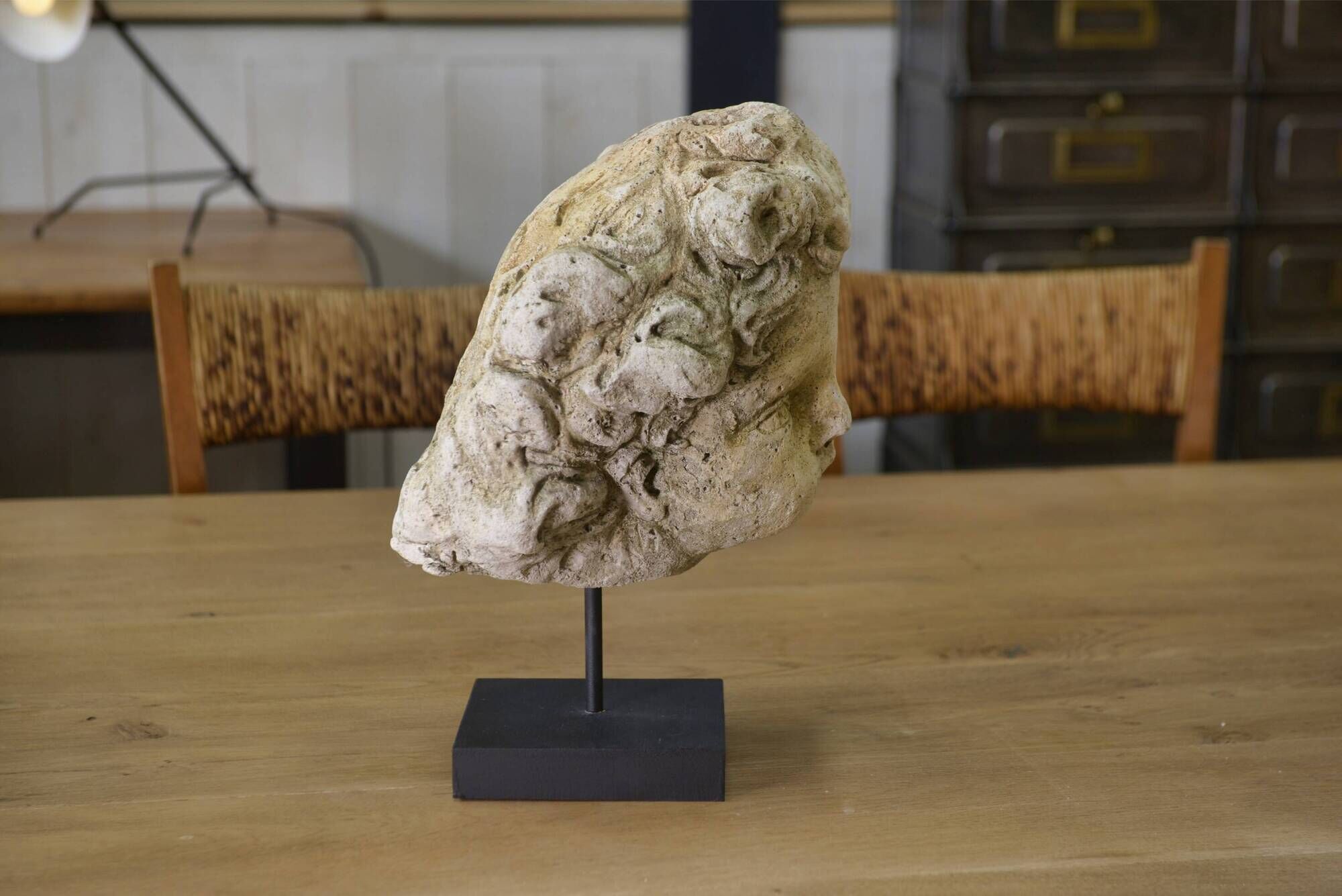 Reconstituted stone sculpture in antique style from the 20th century.