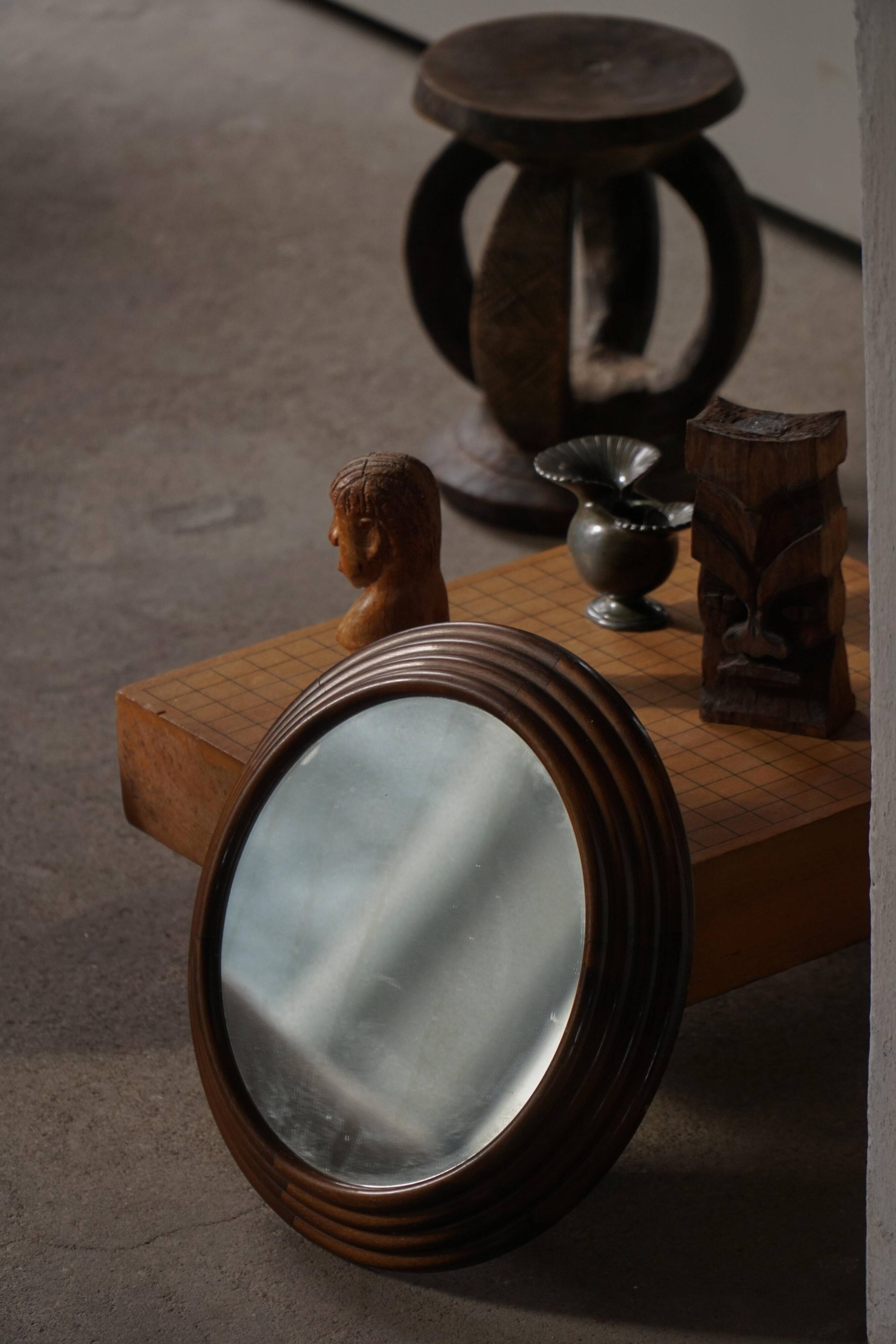 Round wooden wall decorative mirror, carved frame, mid-20th century, 1950s.