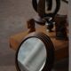 Round wooden wall decorative mirror, carved frame, mid-20th century, 1950s.
