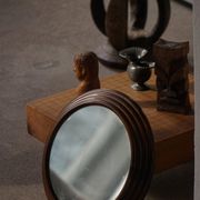 Round wooden wall decorative mirror, carved frame, mid-20th century, 1950s.