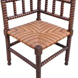 Old corner straw armchair in turned wood
