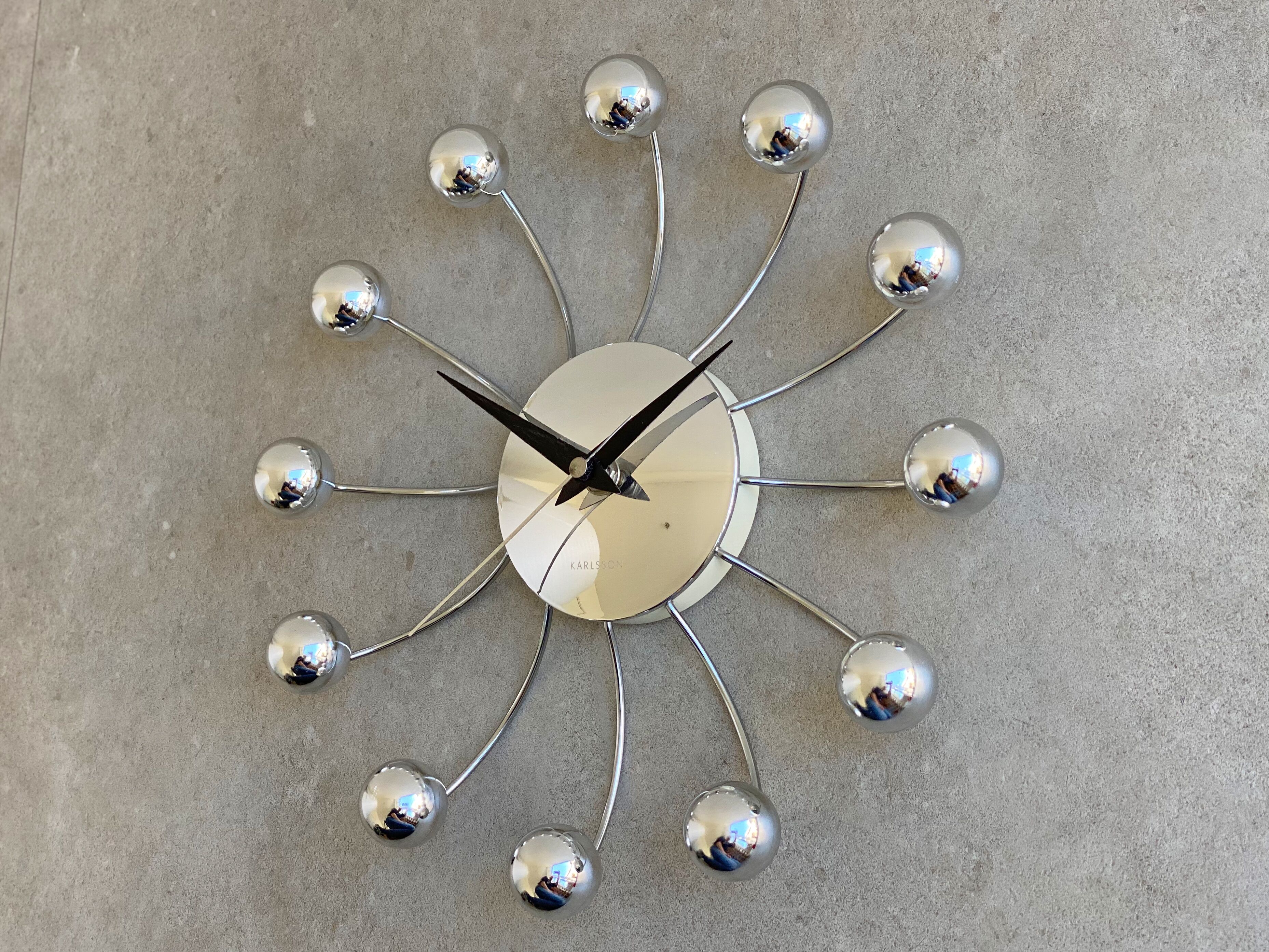 Chrome Karlsson spider wall clock with black hands, sputnik space age