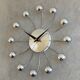 Chrome Karlsson spider wall clock with black hands, sputnik space age