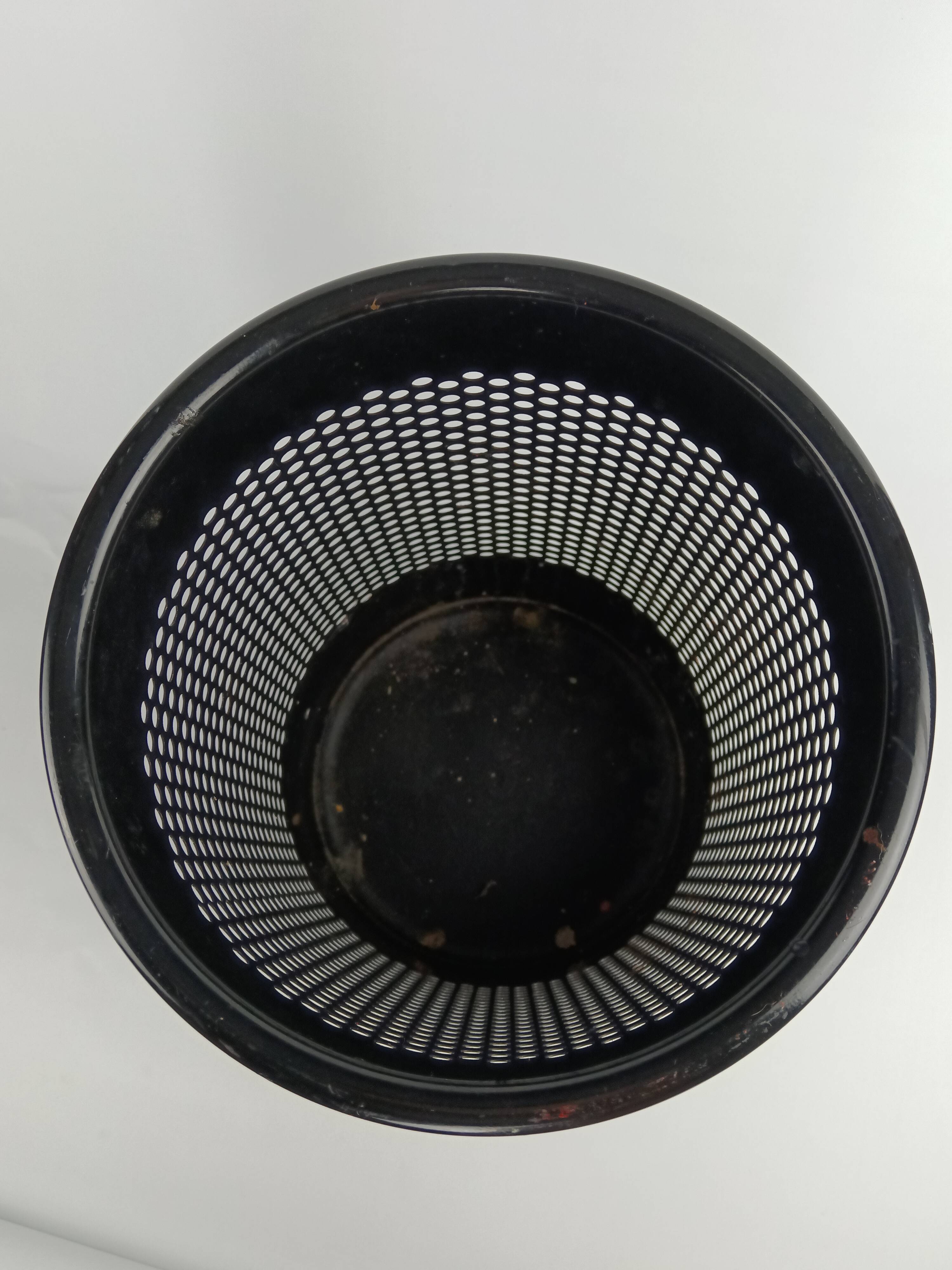Perforated metal wastebasket