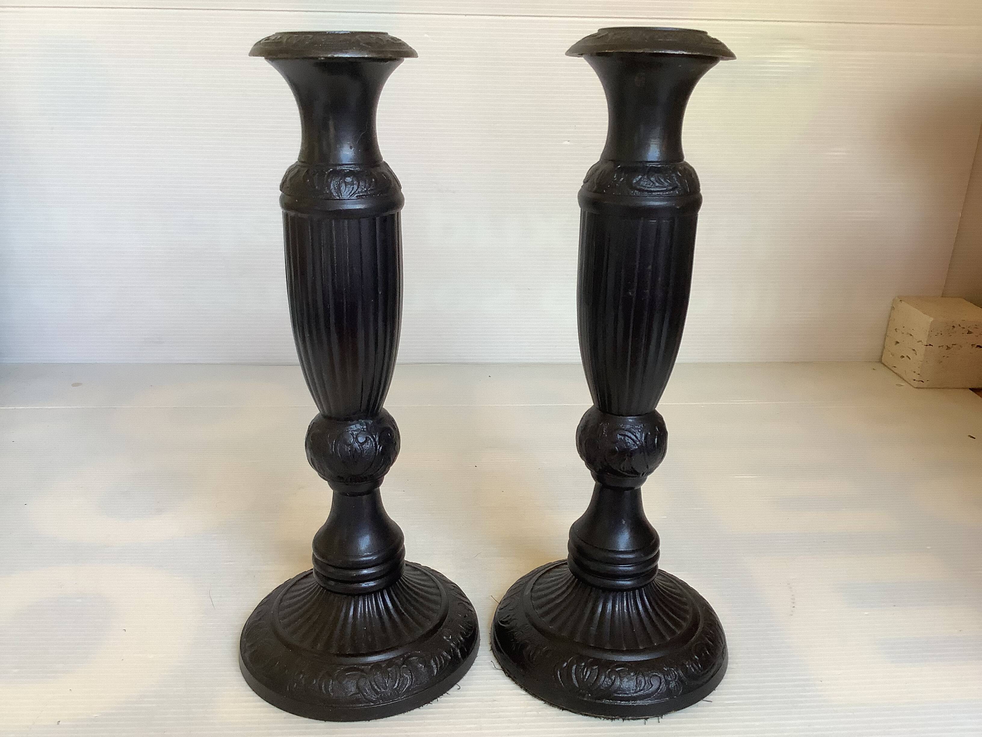 Pair of large black metal candlesticks
