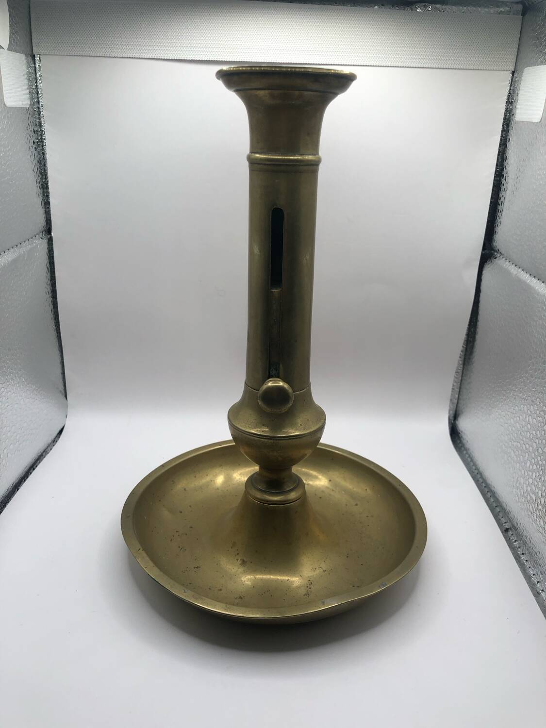 Candle holder with a pusher
