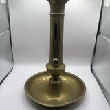 Candle holder with a pusher