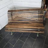Old cast iron garden bench with oak slats