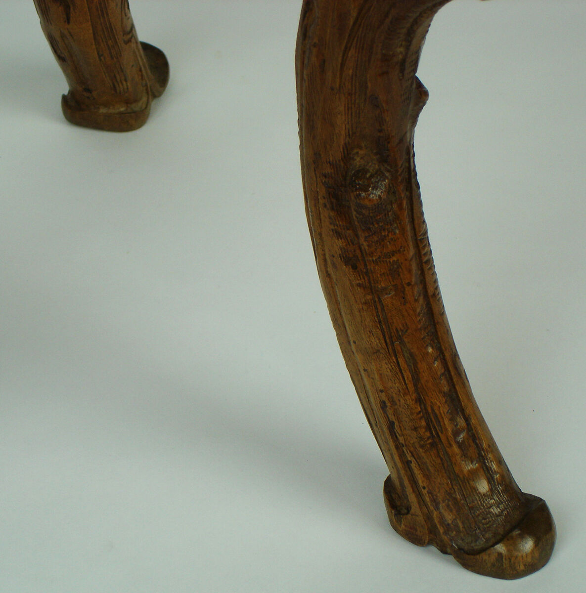 Sculpted chair in "black drill" style