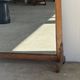 Very large freestanding teak mirror with an openwork carved pediment, Indonesia.