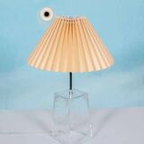 Minimalist glass table lamp from the 80s with a pleated shade.