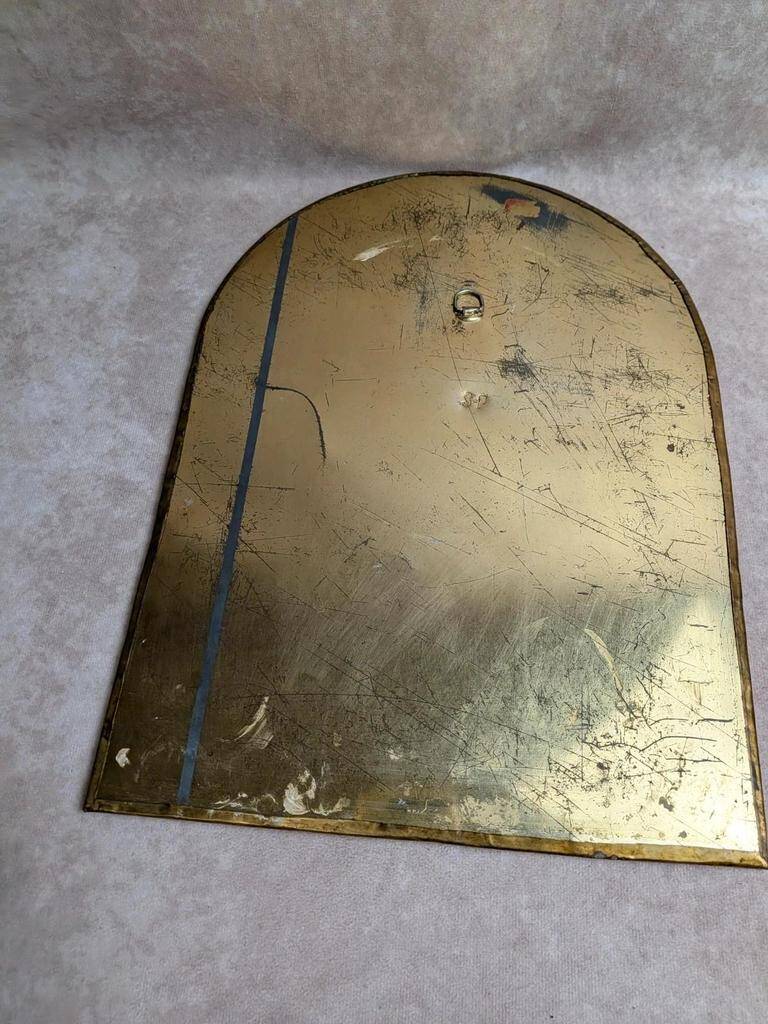 Vintage Moroccan wall mirror in brass, arch shape.