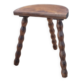 Tabouret tripode demi rond pieds boules
