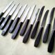 Box of 12 vintage table knives in stainless steel and brown bakelite