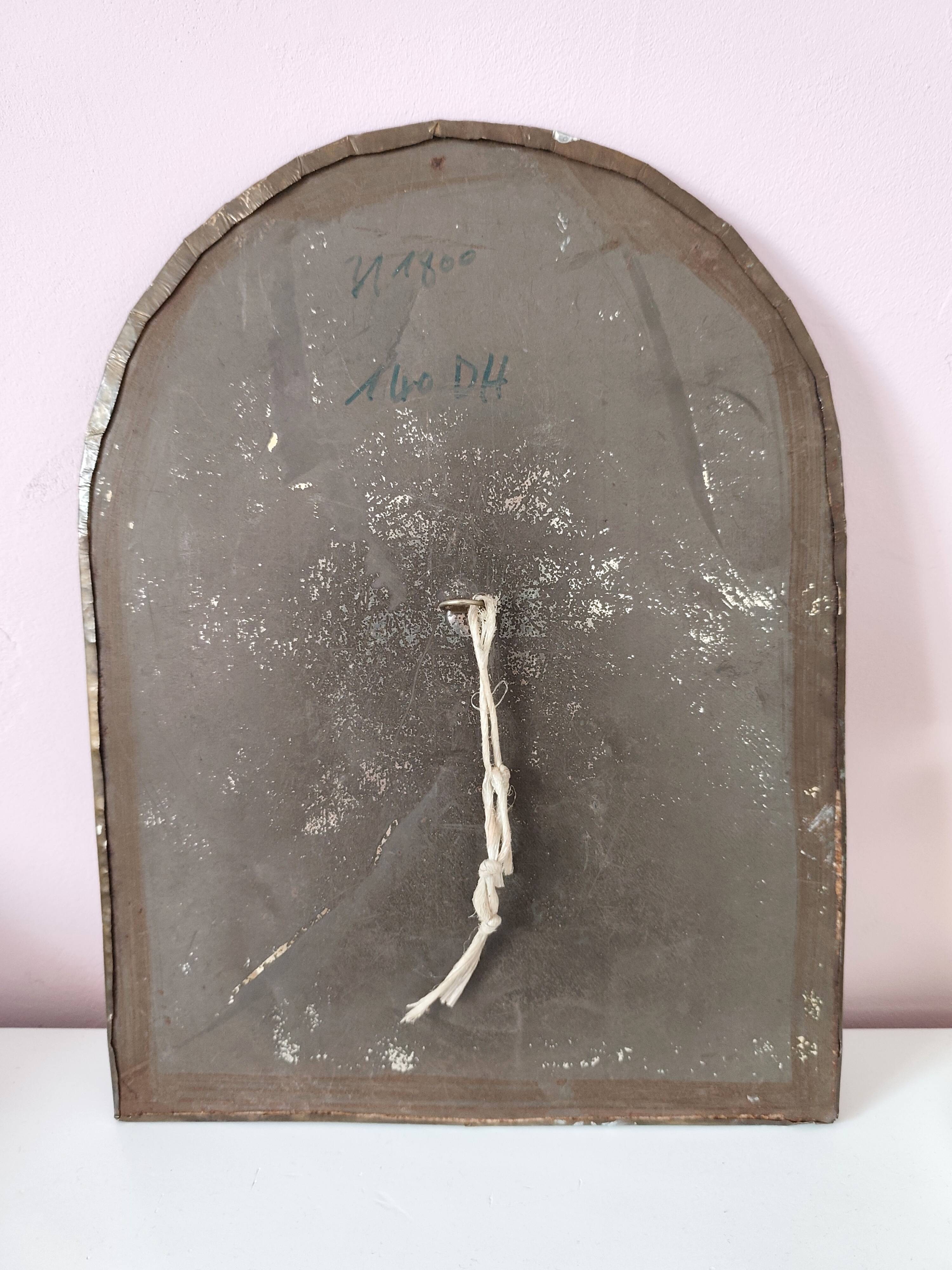 Small golden metal mirror in oriental style.