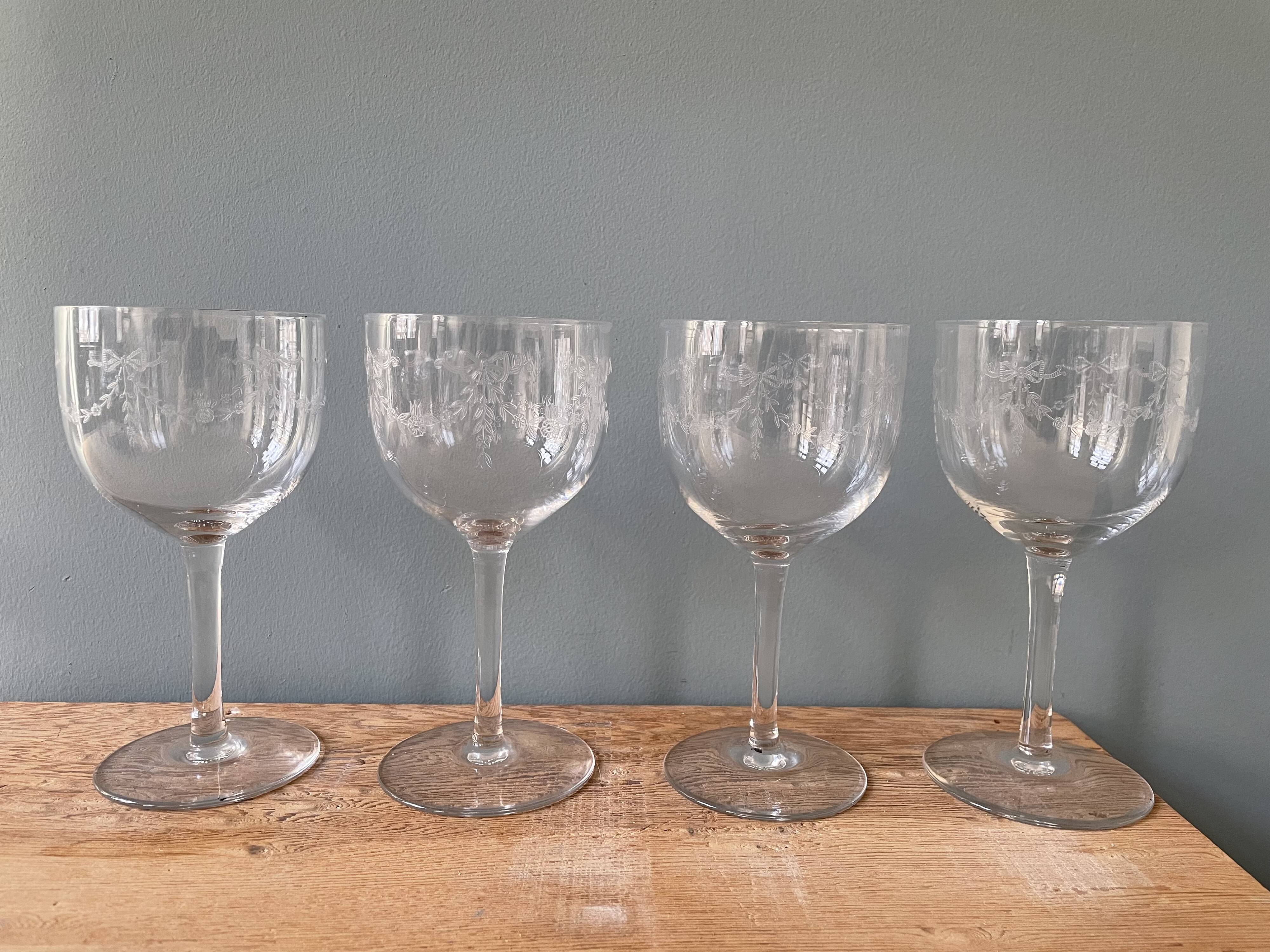 Set of 4 antique chiseled crystal foot glasses